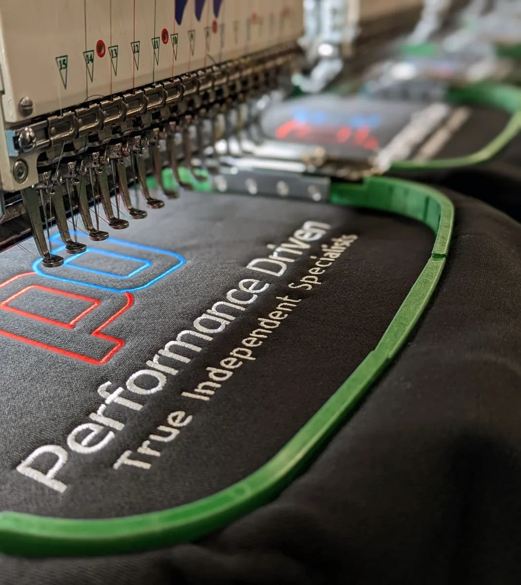 Custom embroidered workwear sample with company logo — embroidery services Richmond